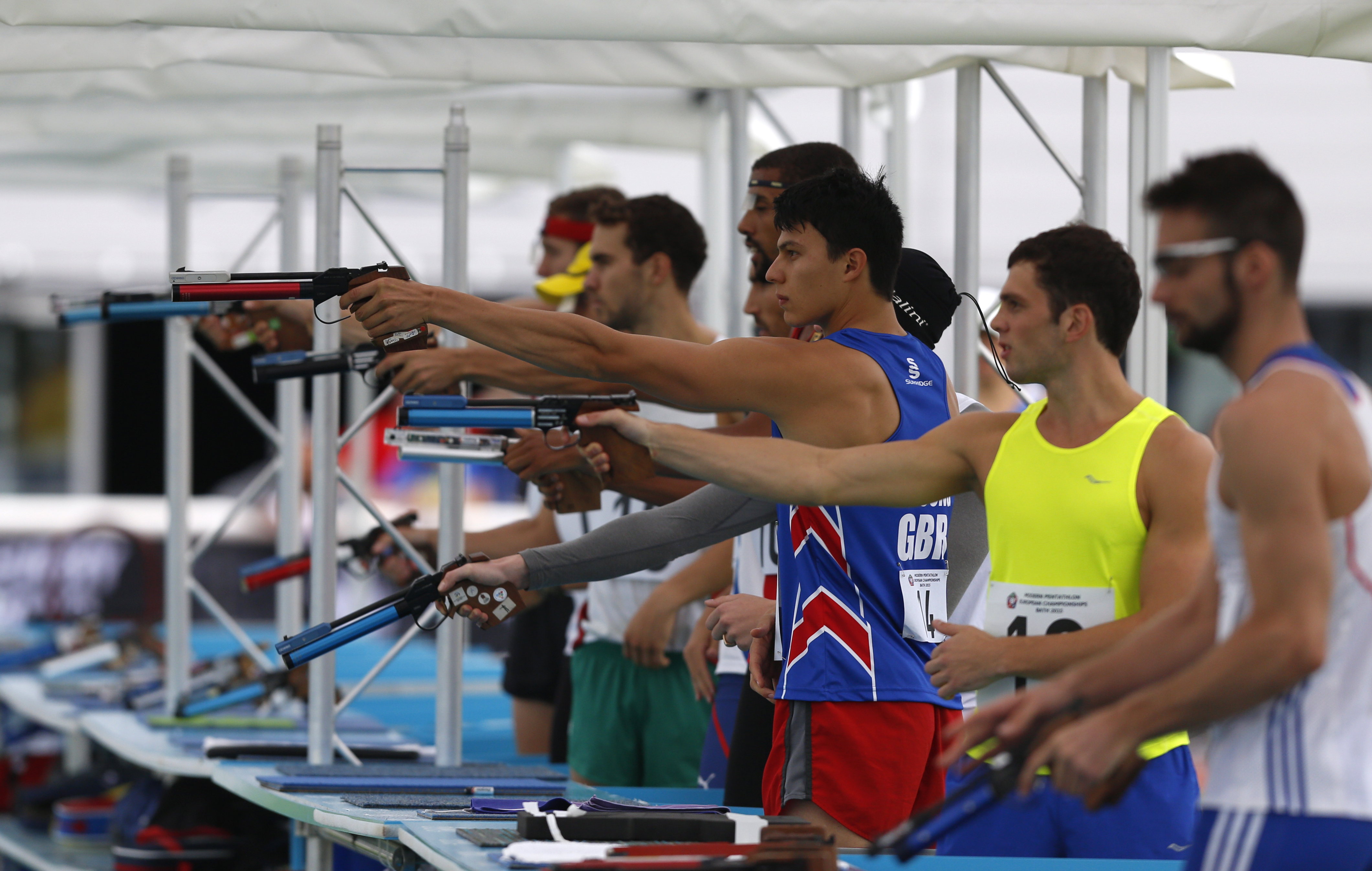 Mens Qualification Rounds - Bath - 20th August 2015 - Joseph Choong (centre in blue) in action in the Combined (run and shoot)  phase of the Modern Pentathlon Mens Qualification rounds. Athletes try to gain a place in the weekend finals held at the University of Bath Sports Training Village.