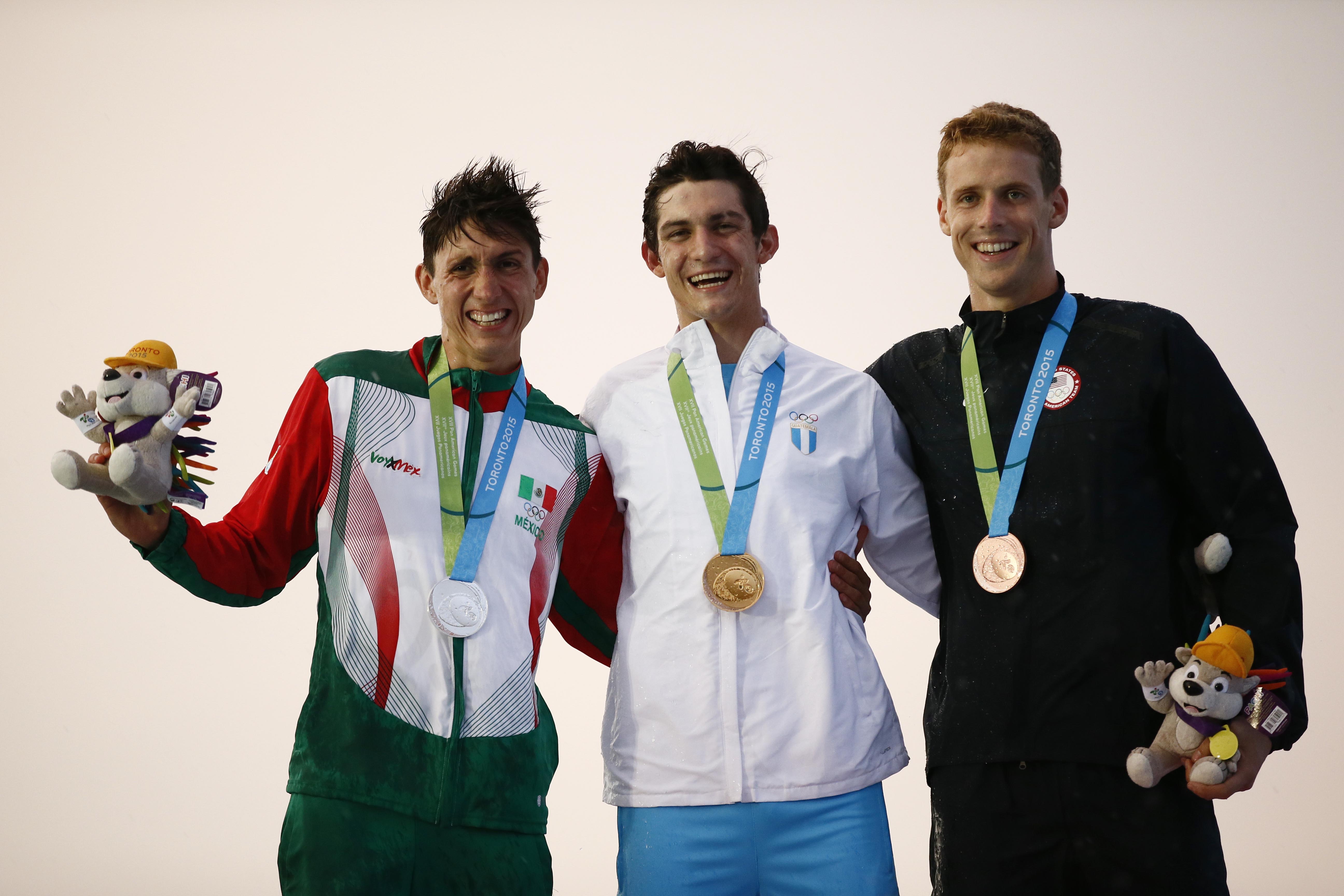 Jul 19, 2015; Toronto, Ontario, CAN; Ismael Hernandez Uscanga of Mexico (left) , Charles Fernandez (middle) and Nathan Schrimsher of the United States on the podium after the men's modern pentathlon during the 2015 Pan Am Games at Pan Am Aquatics UTS Centre and Field House. Mandatory Credit: Rob Schumacher-USA TODAY Sports